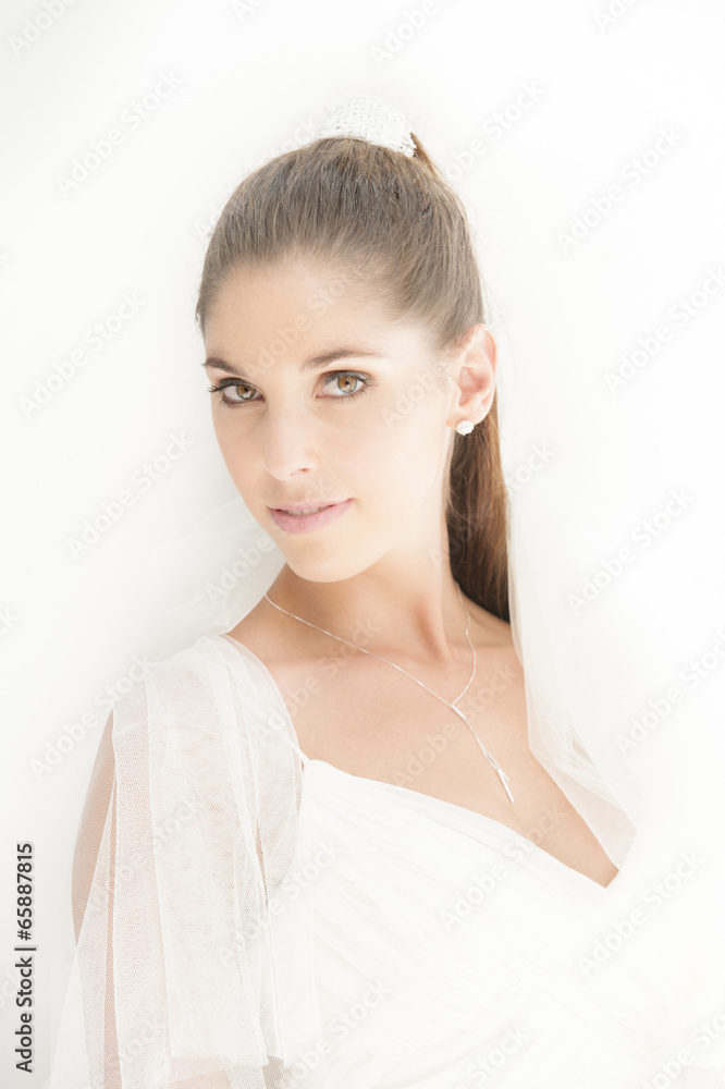 Close up of beautiful bride's face on white Close up of beautiful bride's face on white