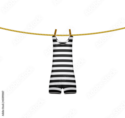 Striped retro swimsuit hanging on rope
