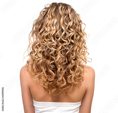 Beauty girl with blonde permed hair. Backside photo