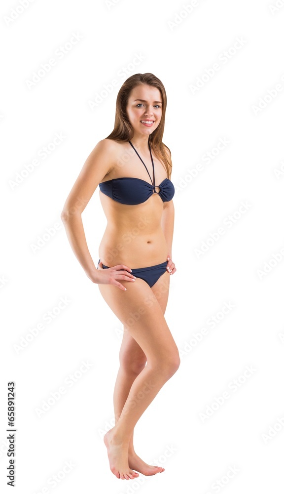 Fit girl in bikini smiling at camera Fit girl in bikini smiling at camera