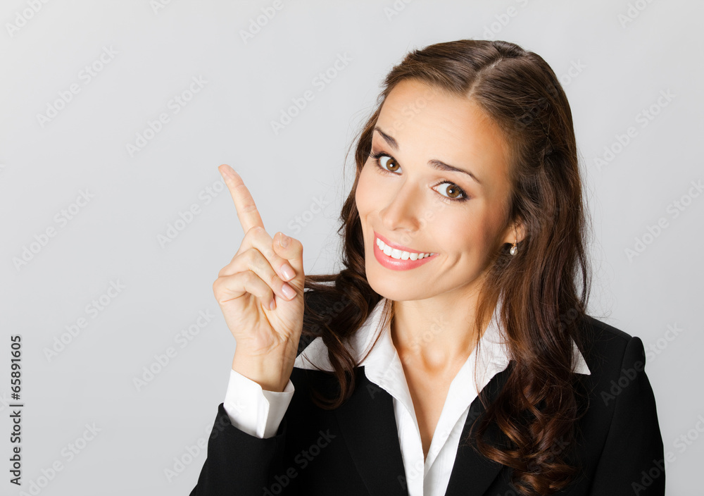 Business woman showing blank area for sign or copyspase, over gr Business woman showing blank area for sign or copyspase, over gr