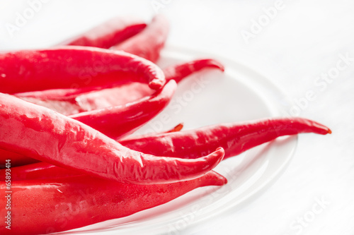 hot chili peppers on white plate