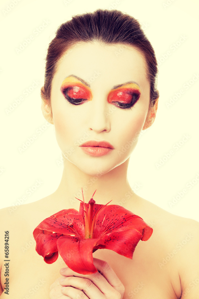 Beautiful woman with a red lily