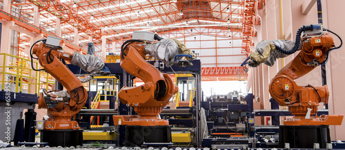 Robots welding in a production line photo