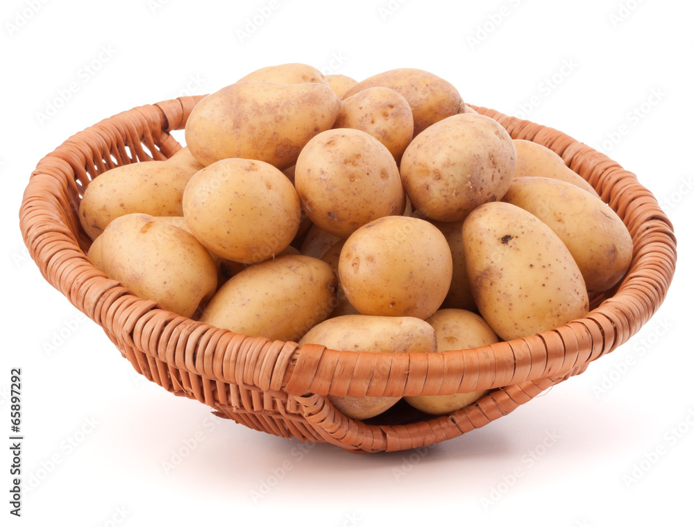 Potato tuber in wicker basket isolated on white background Potato tuber in wicker basket isolated on white background