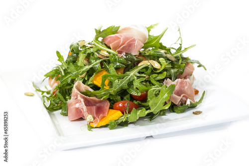 salad of arugula ham cheese on a white background