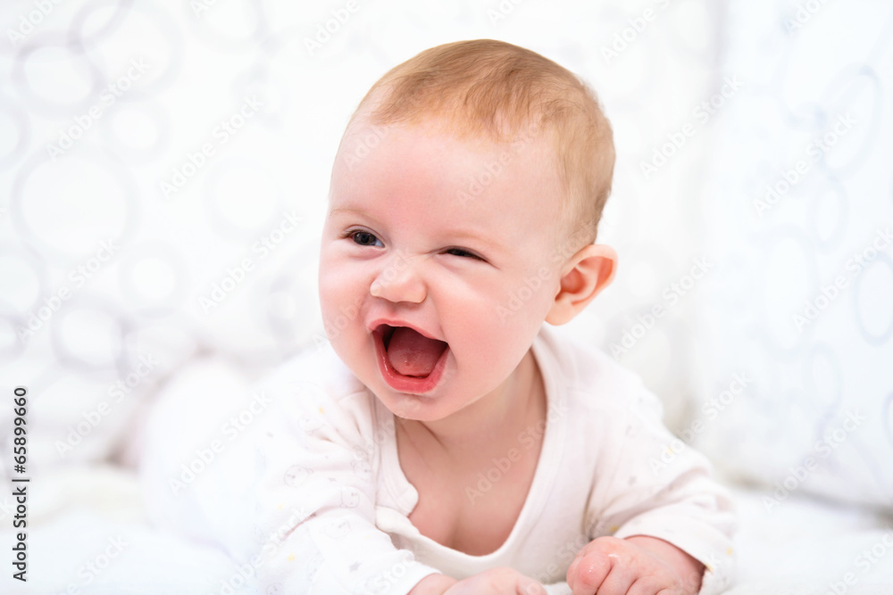 Smiling Baby Girl are Lying in the Bed Smiling Baby Girl are Lying in the Bed