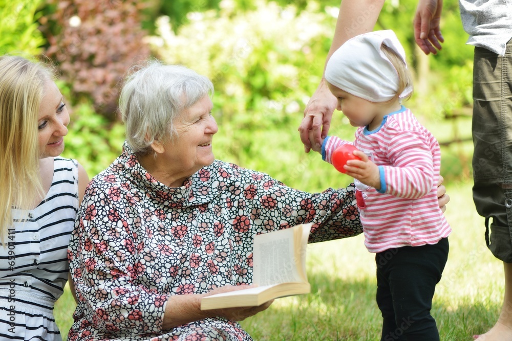 Family in park. Grandmother and granddaughter.
