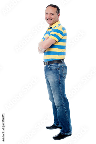 Casual man standing with his arms crossed