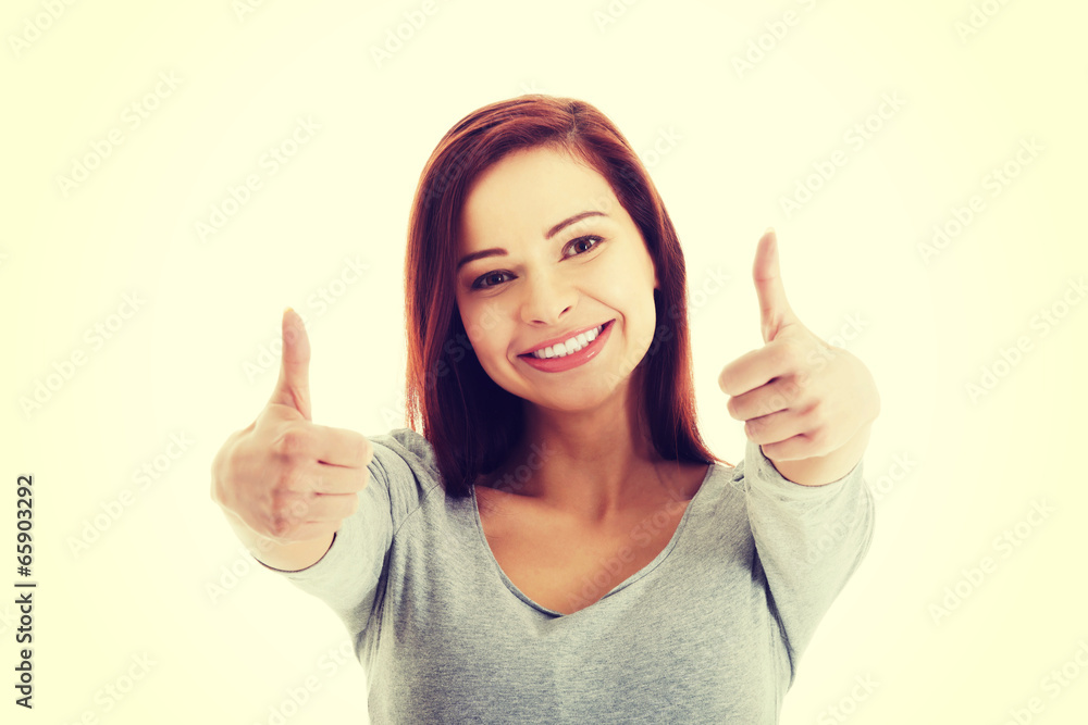 Portrait of casual beautiful woman showing OK. Portrait of casual beautiful woman showing OK.