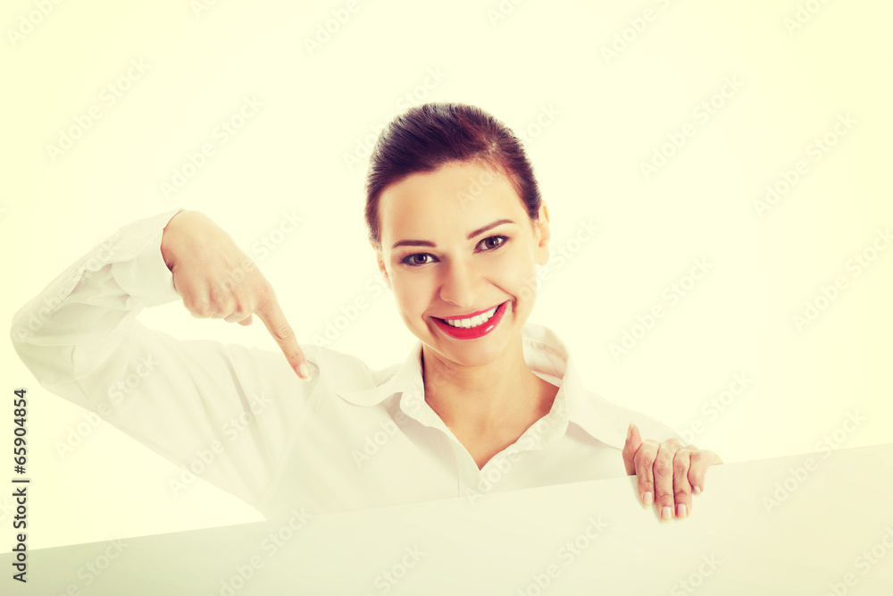 Beautiful business woman pointing on copy space. Beautiful business woman pointing on copy space.