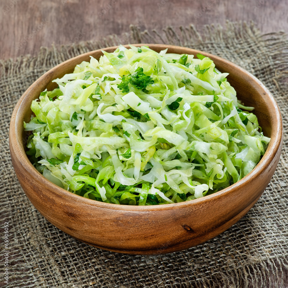 Cabbage salad in wooden bowl Cabbage salad in wooden bowl