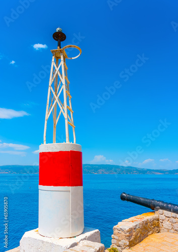 Canvastavla The red port light of the main harbor of Hydra island in Greece