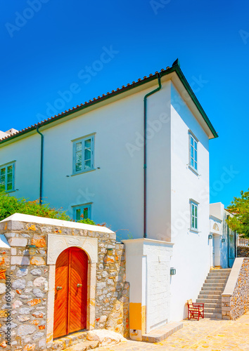 old  house over the main port of Hydra island in Greece photo