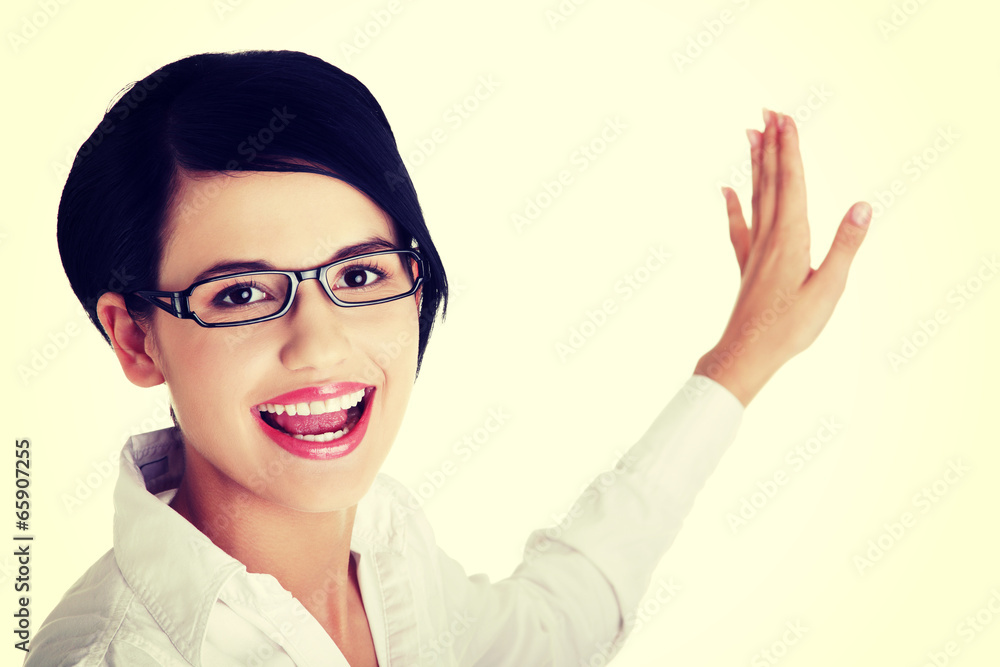 Beautiful business woman showing copy space Beautiful business woman showing copy space