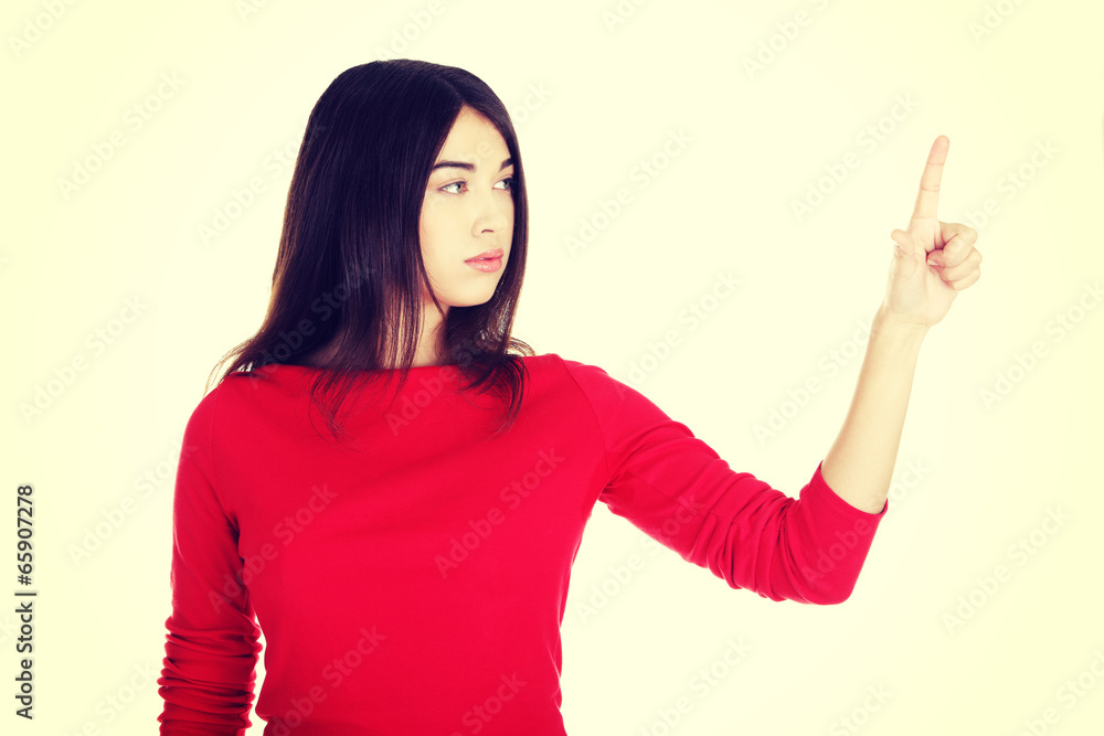 Beautiful woman making choose on abstract screen Beautiful woman making choose on abstract screen