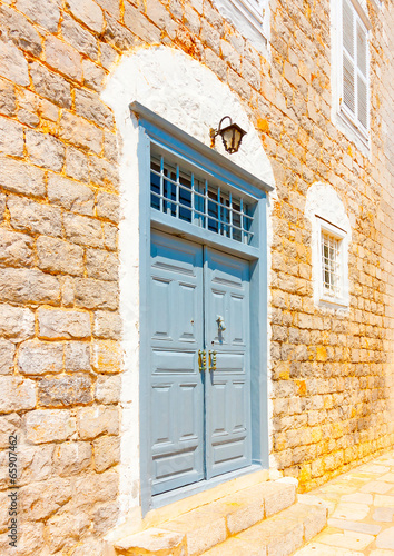 wooden door of an old house in Hydra island in Greece photo