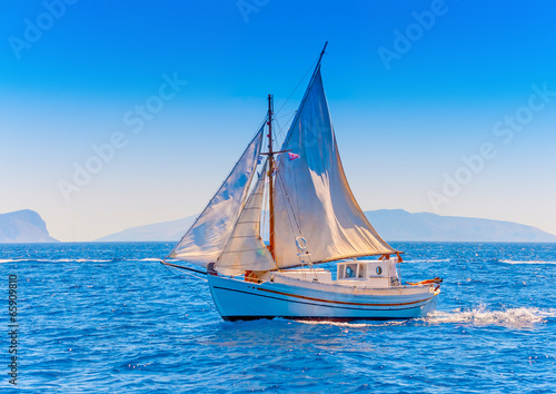 Old wooden Greek boat (Kaiki) in Spetses island in Greece photo