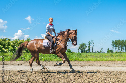 Girl riding a horse