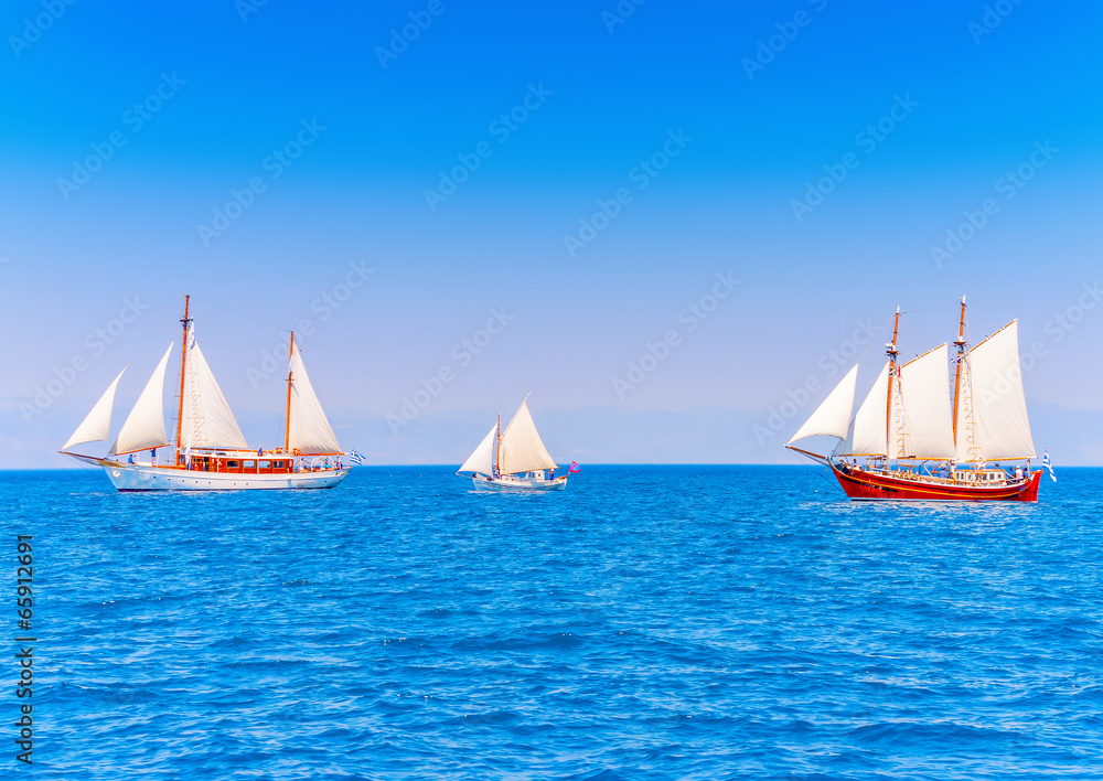 Naklejka premium several classic wooden sailing boats in Spetses island in Greece