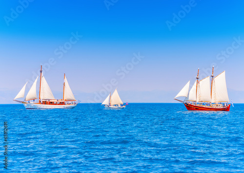 several classic wooden sailing boats in Spetses island in Greece