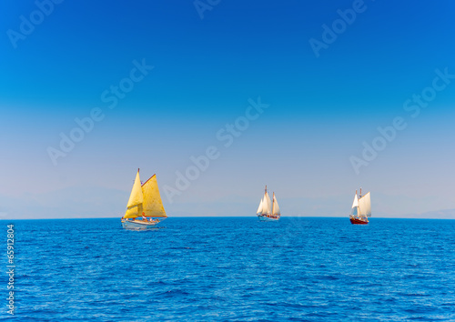 several classic wooden sailing boats in Spetses island in Greece