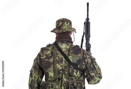 Soldier in camouflage and modern weapon M4.