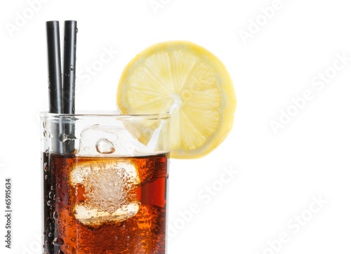 glass of fresh coke with straw with lemon slice on top