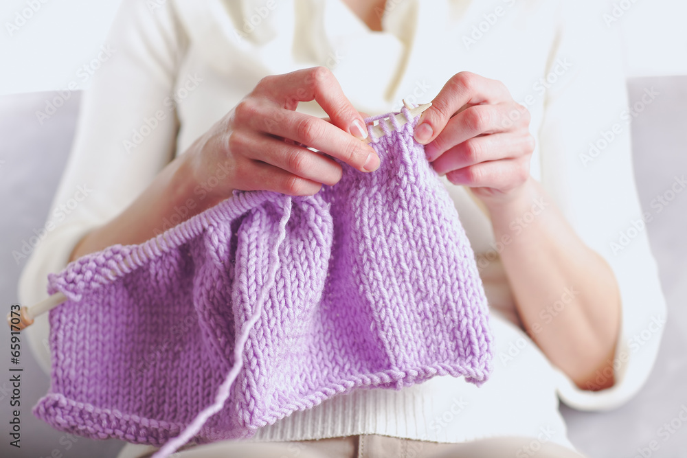 photography closeup of a woman knits