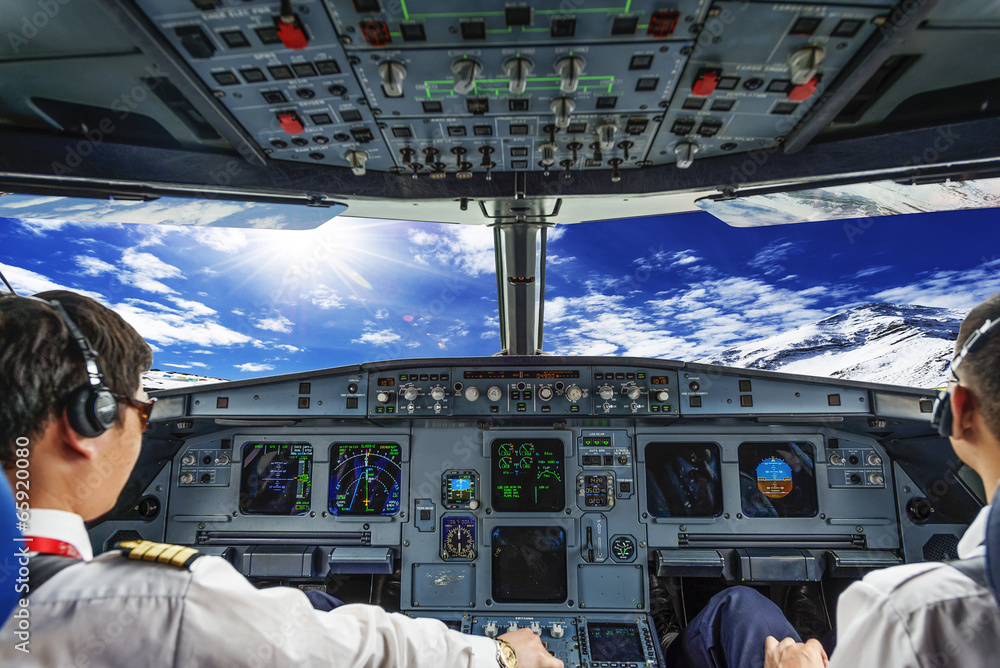 Fototapeta premium Pilots in the plane cockpit
