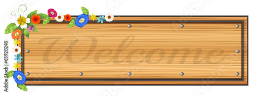 A wooden signboard with plants