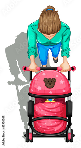 A topview of a mother pushing a stroller with a baby