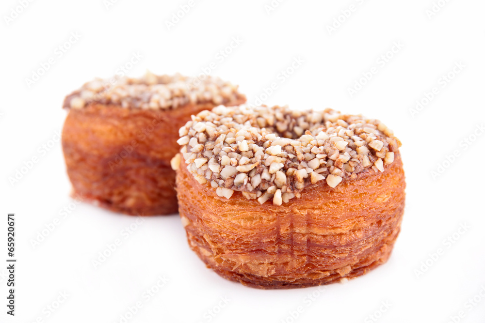 cronuts, puff pastry with nuts and chocolate cronuts, puff pastry with nuts and chocolate