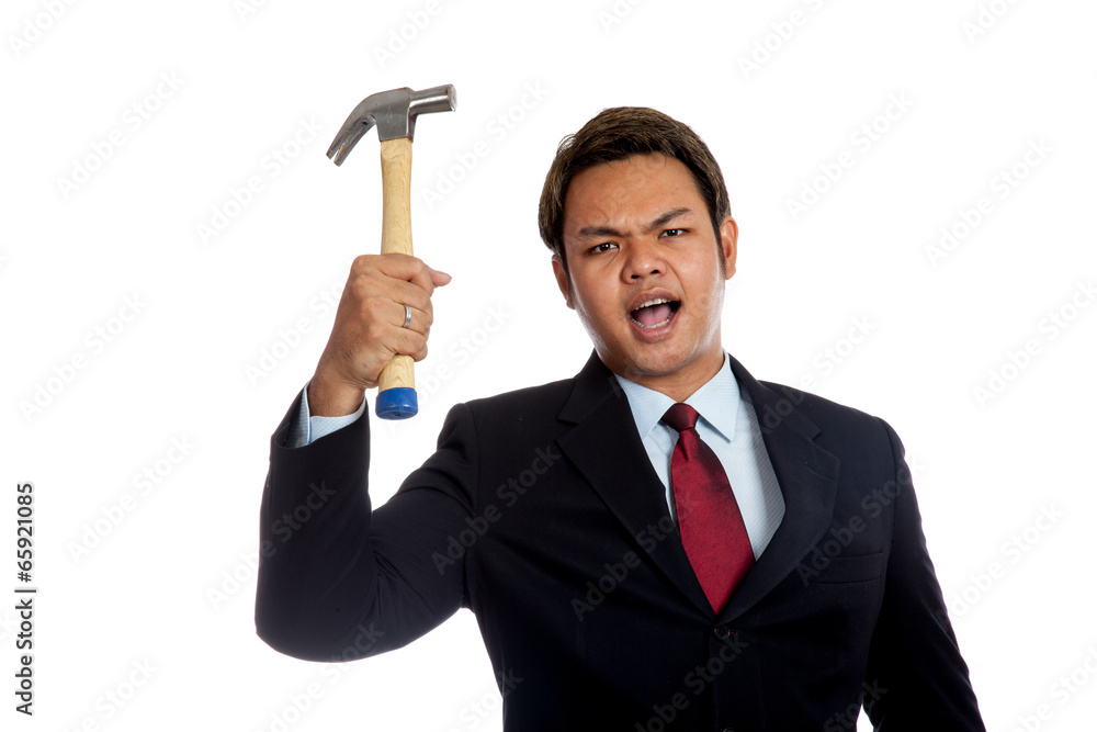 Aggressive Asian businessman angry hold a hammer Aggressive Asian businessman angry hold a hammer