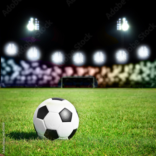 football on the grass field with stadium light © totojang1977