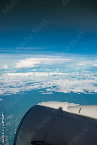 Cloud and blue sky from plane © kwanchaichaiudom