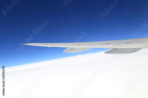 airplane wing above sky