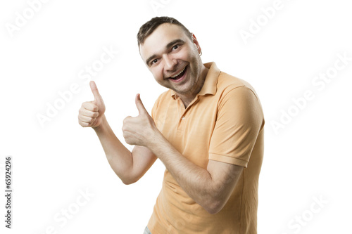 Joyful tall guy hands showing thumbs up sign photo