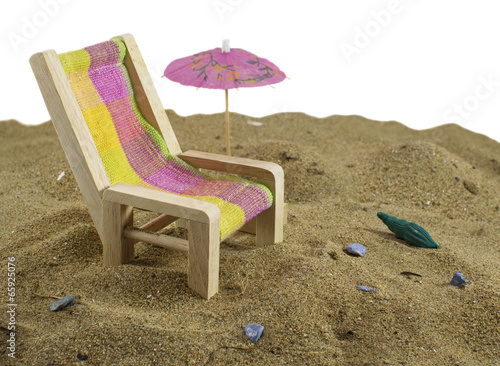 Beach chair with umbrella isolated