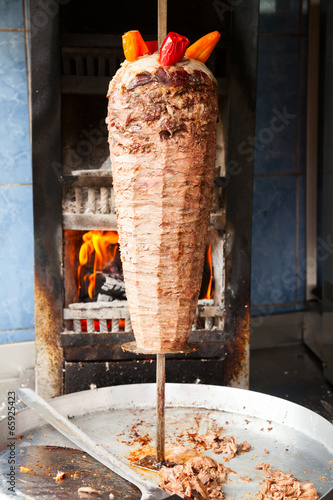 Shawarma meat on rotating spit photo
