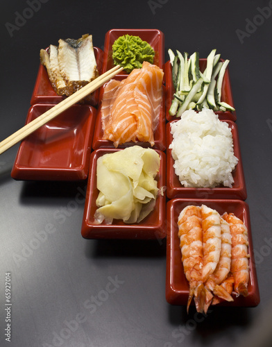 Ingredients for sushi: sliced salmon cucumber rice  photo