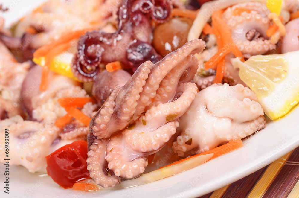 octopus salad olives, carrots , lemon