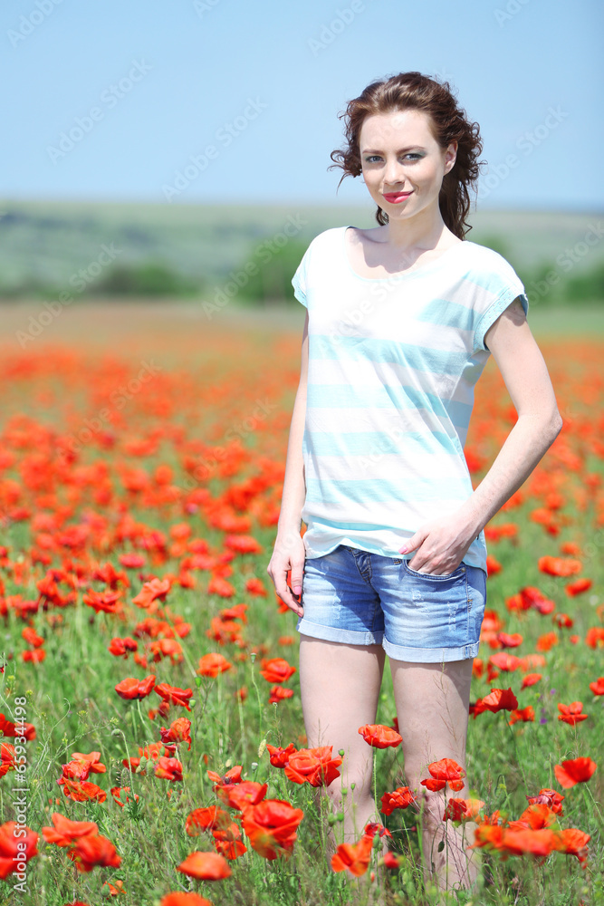 Beautiful young woman in poppy field Beautiful young woman in poppy field