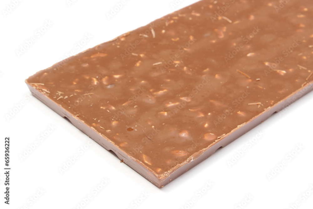 Whole chocolate with nuts and raisins on white background Whole chocolate with nuts and raisins on white background