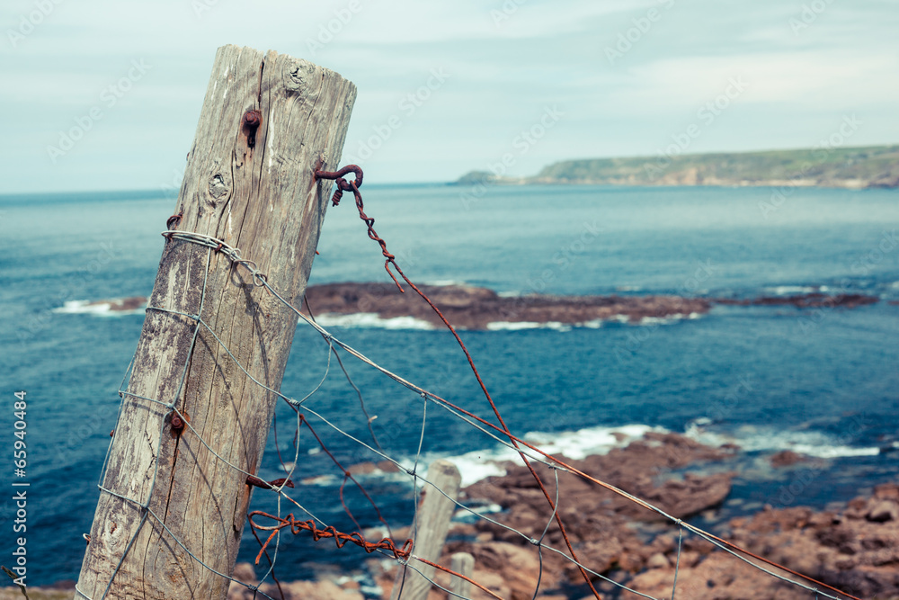 Old fence post by the sea