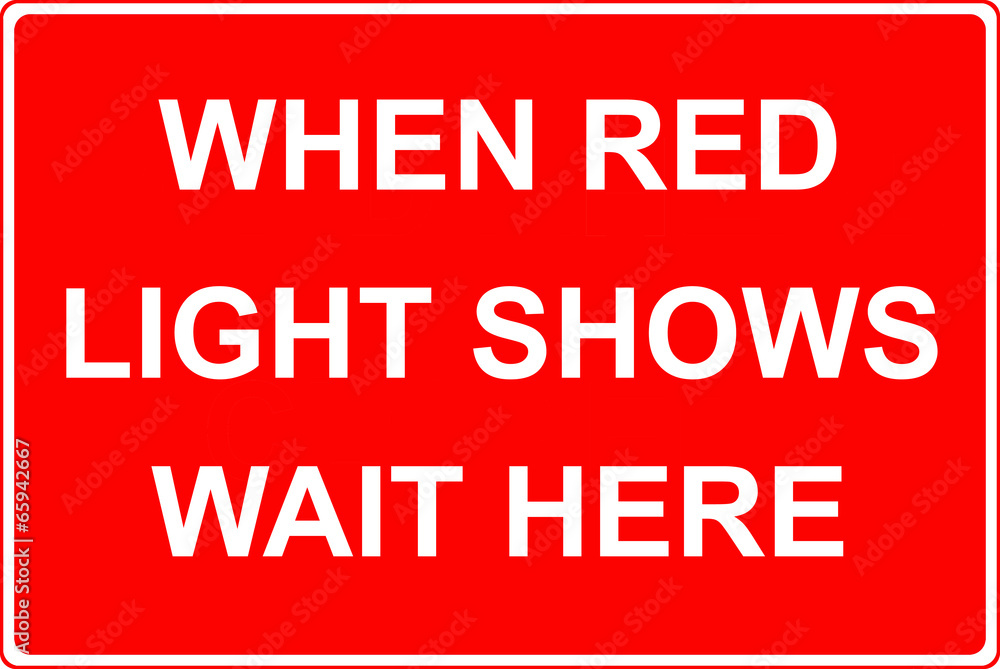 When red light shows wait here sign