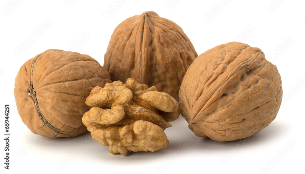 whole and cracked walnut isolated on the white background whole and cracked walnut isolated on the white background