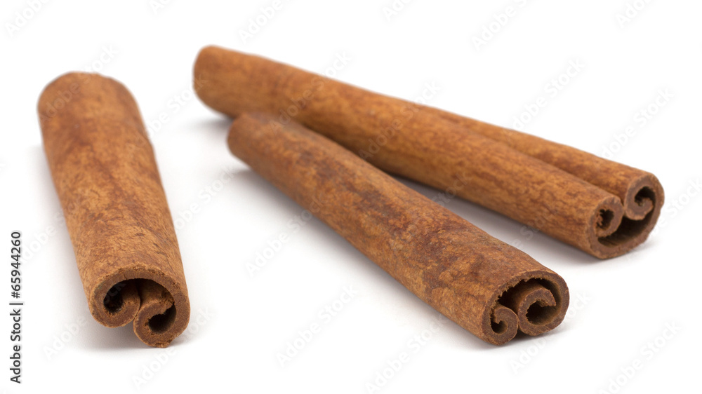 cinnamon sticks stacked on white background cinnamon sticks stacked on white background