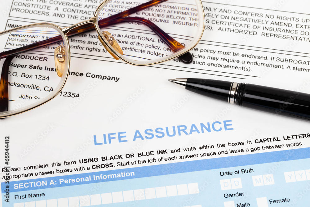 Life assurance application form with pen and glasses concept for Life assurance application form with pen and glasses concept for