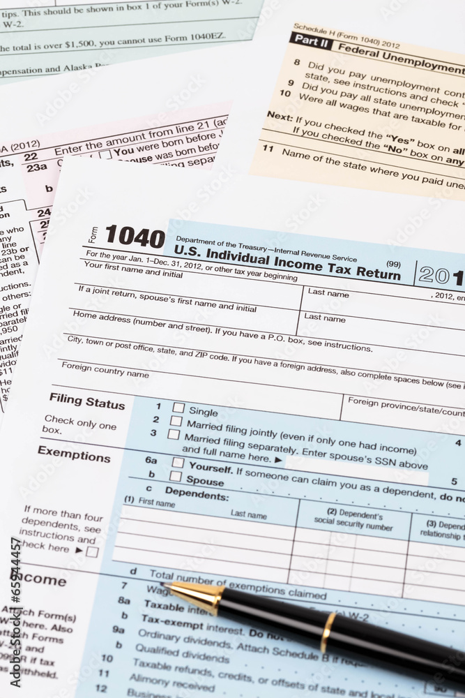 Tax form with pen taxation concept Tax form with pen taxation concept